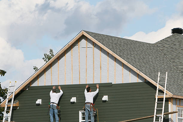 Professional Siding technician working in Perry, FL